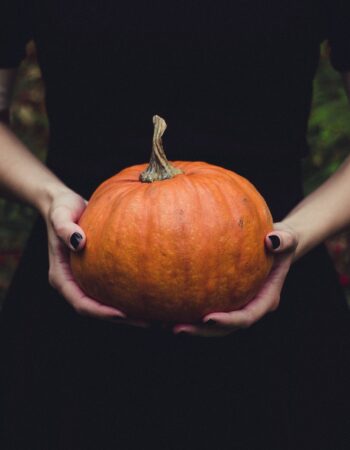 woman holding pumpkin